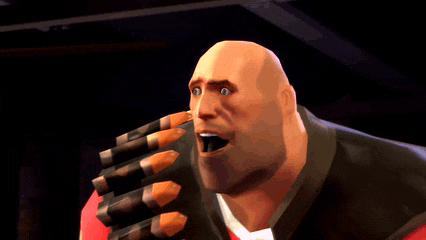 a bald man in a red shirt and black vest is smiling while holding a bunch of bullets