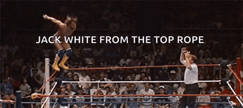 a wrestler is jumping over a rope in a wrestling ring with the caption jack white from the top rope
