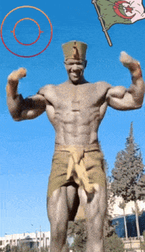 a statue of a man with a flag behind him