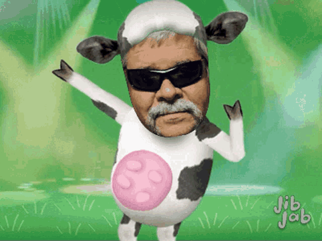 a man in a cow costume with jib jab written on the bottom right