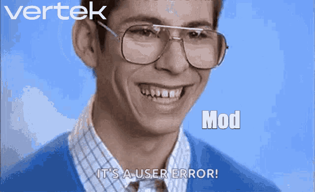 a man wearing glasses and a blue sweater is smiling and says it 's a user error