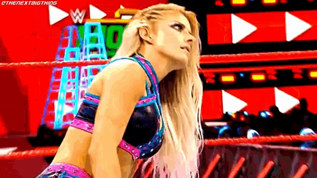 a pixel art of a woman in a wrestling ring with the words " the next big thang " on the bottom