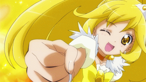 a girl with yellow hair is smiling and reaching out