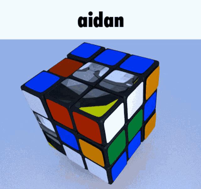 a picture of a rubik 's cube with the name aidan on it
