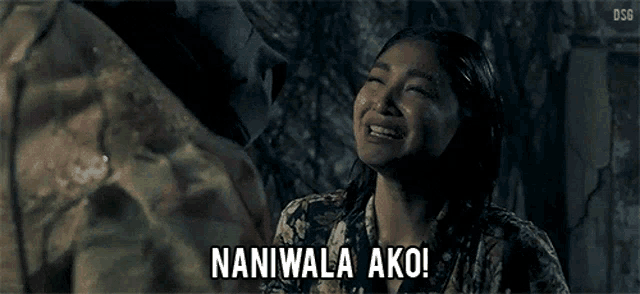 a woman in a floral shirt is crying and says naniwala ako