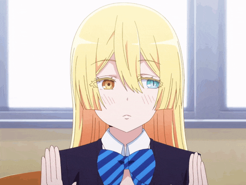a girl with blonde hair and two different colored eyes