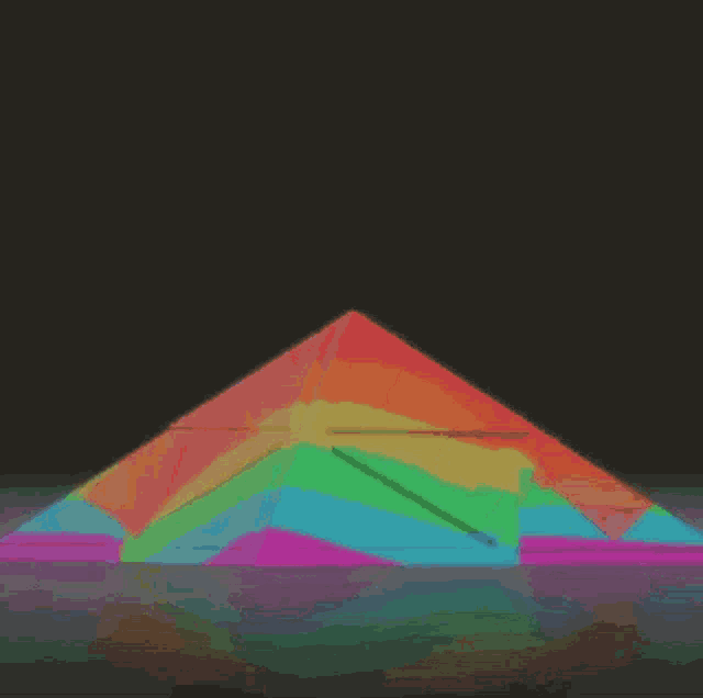 a rainbow colored pyramid is floating in the air