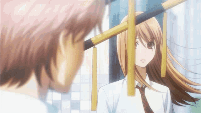 a boy and a girl are standing next to each other and the girl is wearing a tie