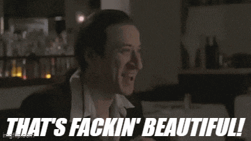 a man says that 's fackin ' beautiful in front of a bar full of bottles