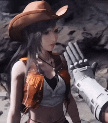 a woman in a cowboy hat is being touched by a robotic arm