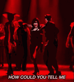 a man and a woman are dancing on a stage with the words " how could you tell me " above them