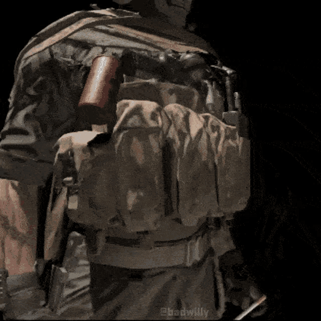 a close up of a soldier 's back with the name badwilly on the bottom right