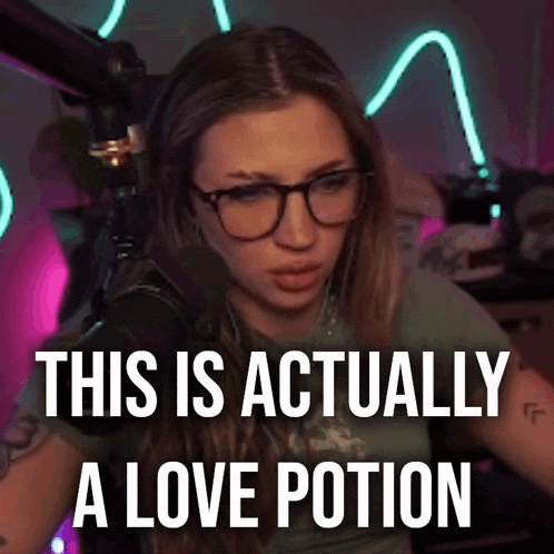 a woman wearing glasses is sitting in front of a microphone and says `` this is actually a love potion ''
