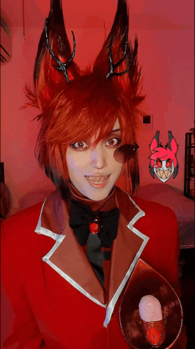 a woman in a red fox costume holds a cup