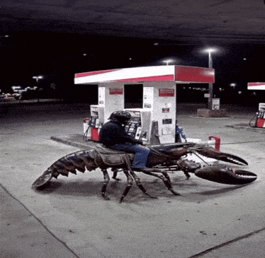 a man is riding on the back of a giant lobster