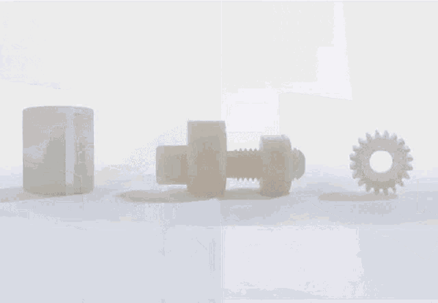 a large stainless steel conveyor belt is sitting on top of a wooden pallet