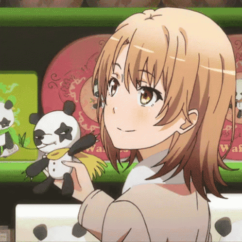a girl is holding a stuffed panda bear in front of a shelf that says waf on it