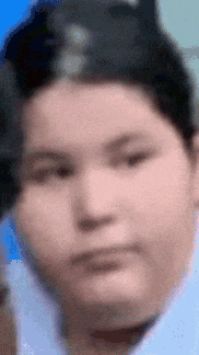 a blurry picture of a young boy 's face