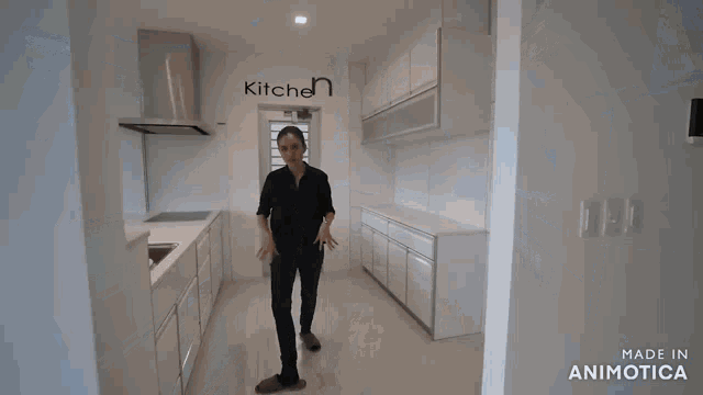 a woman is washing dishes in a kitchen that is made in animatica