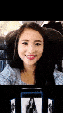a woman is smiling while sitting in a chair