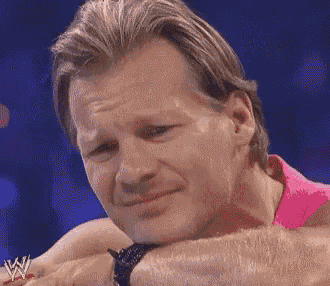 a close up of a man 's face with a w logo on his arm