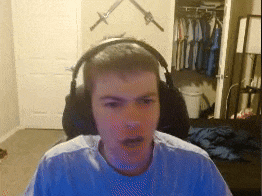 a man wearing headphones is sitting in front of a closet with swords on the wall