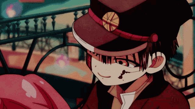 a close up of a person wearing a hat with a circle on it