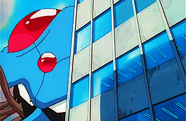 a cartoon character is standing in front of a blue building .