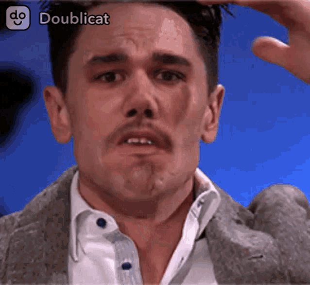 a man 's face is shown in a doublecat app