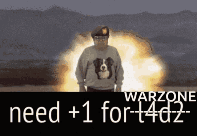 a man in a sweater with a dog on it is standing in front of an explosion and says warzone need +1