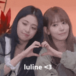 two girls are making a heart shape with their hands and the words luline < 3 are below them .