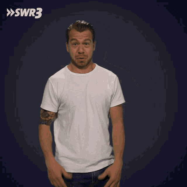 a man in a white t-shirt is making a funny face in front of a blue background that says swr3