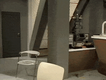 a chair is sitting in a room next to a door