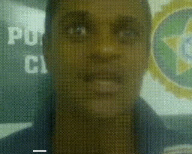 a blurred image of a man 's face with the word policia in the background