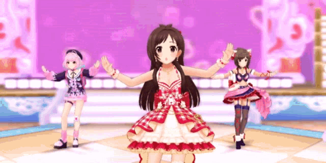 a group of anime girls are dancing on a stage in front of a purple background