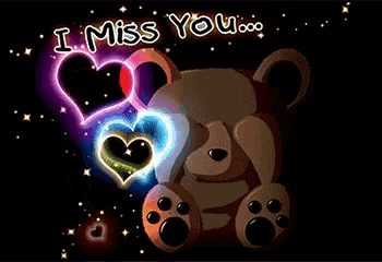 a teddy bear holding a heart with the words i miss you