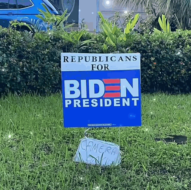 a republicans for biden president sign in the grass