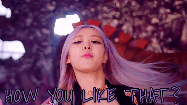 a woman with purple hair and the words how you like that