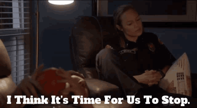 a woman in a police uniform sits on a couch with the words " i think it 's time for us to stop "