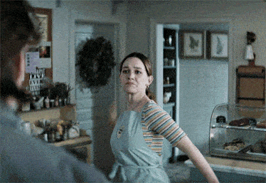 a woman in an apron with a name tag that says ' amanda '