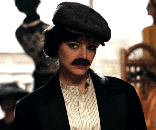 a woman with a mustache and a hat on
