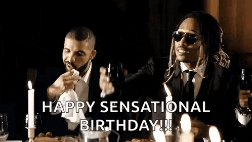 drake and future are sitting at a table with candles and drinking wine .