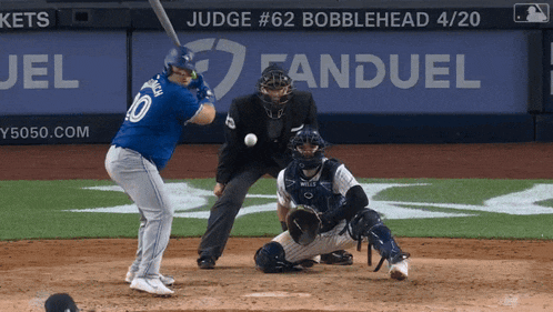 a baseball player with the number 10 on his jersey swings at the ball