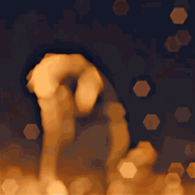 a silhouette of a person standing in front of a flame
