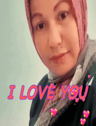 a woman wearing a pink scarf and a black jacket with the words i love you above her