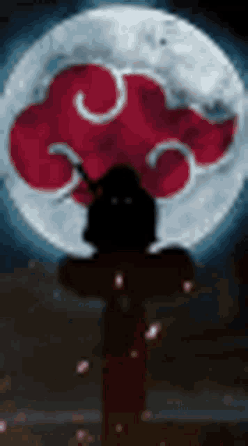 a person is standing in front of a full moon with a red cloud in the background .