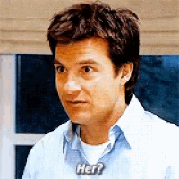 a man in a blue shirt is asking her
