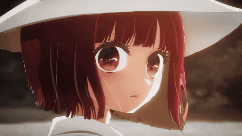 a girl with red hair and a white hat looks at the camera
