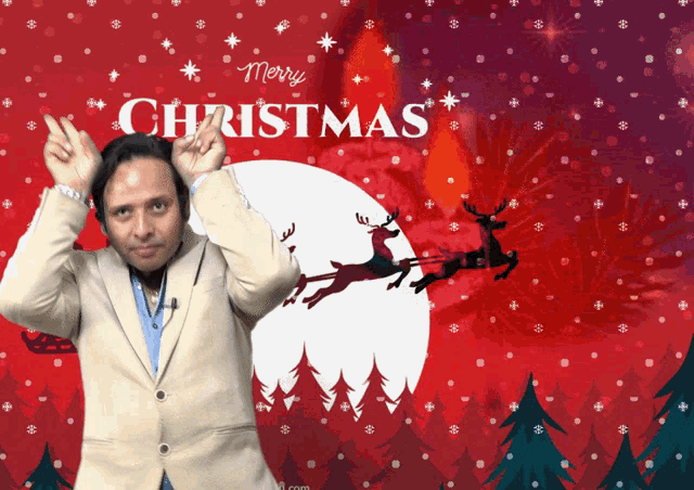 a man in front of a merry christmas poster