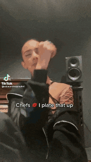 a man sitting in front of a piano with chefs i plate that up written on his face